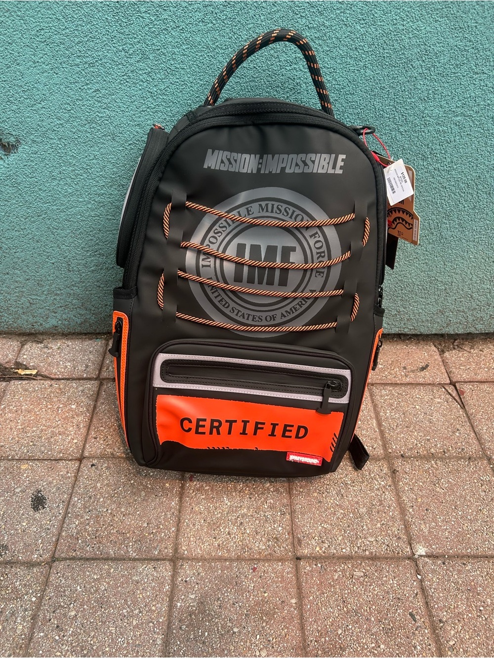 Sprayground Black and Orange 'Mission: Impossible' Certified Backpack
